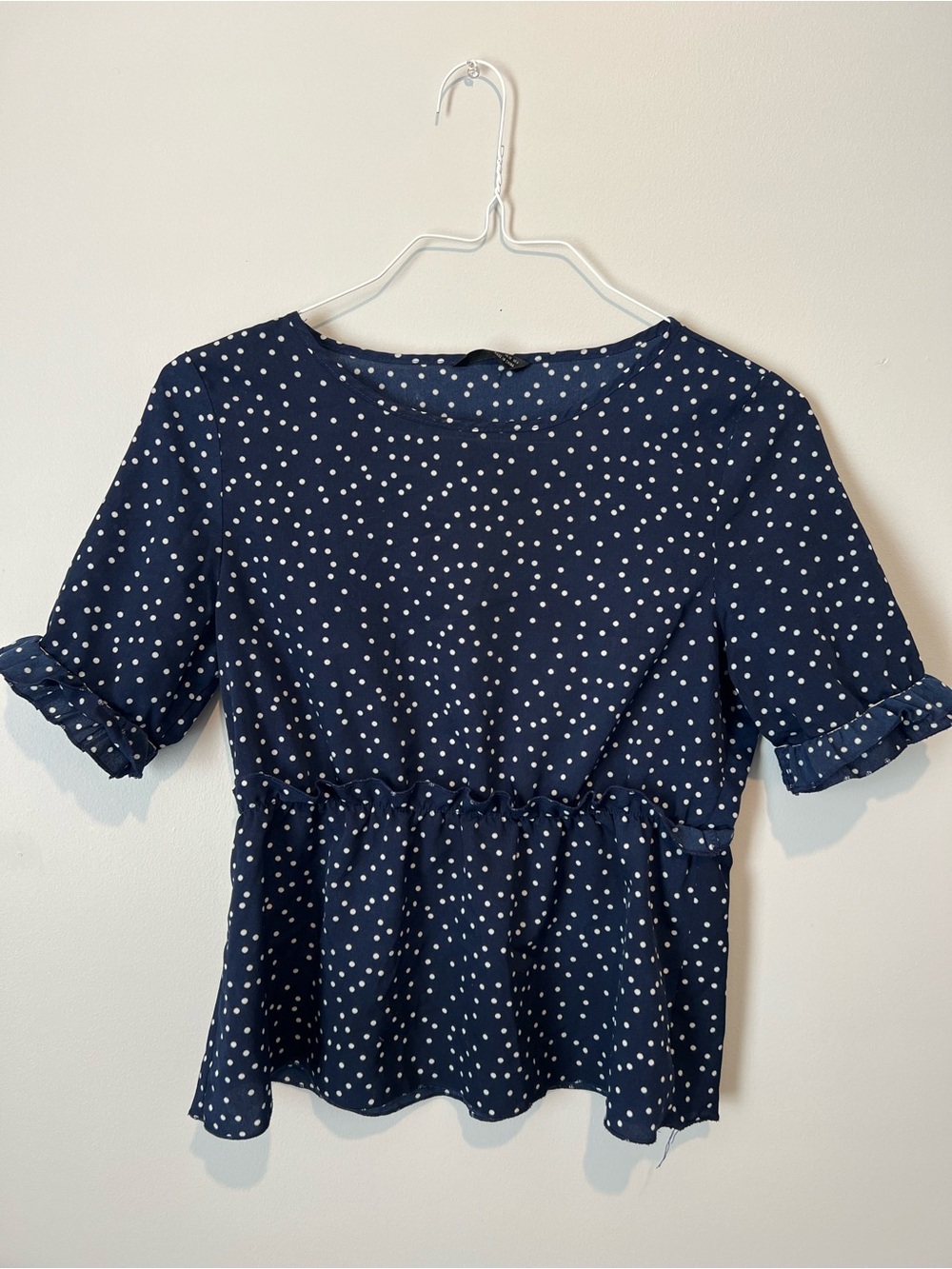 Navy Polka Dot Peplum Blouse with Ruffle Sleeves